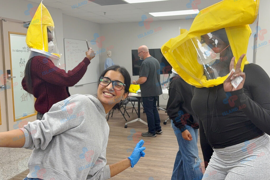 Trainer and students engaging in a fun, interactive first aid session at IslandAid.
