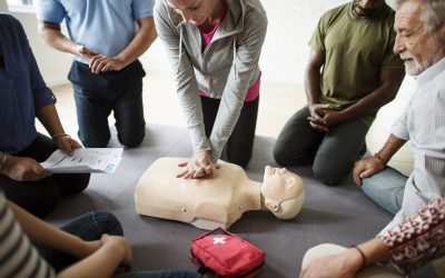 Group of diverse people in cpr training class Emergency First Aid and CPR Level C course for essential life-saving skills.